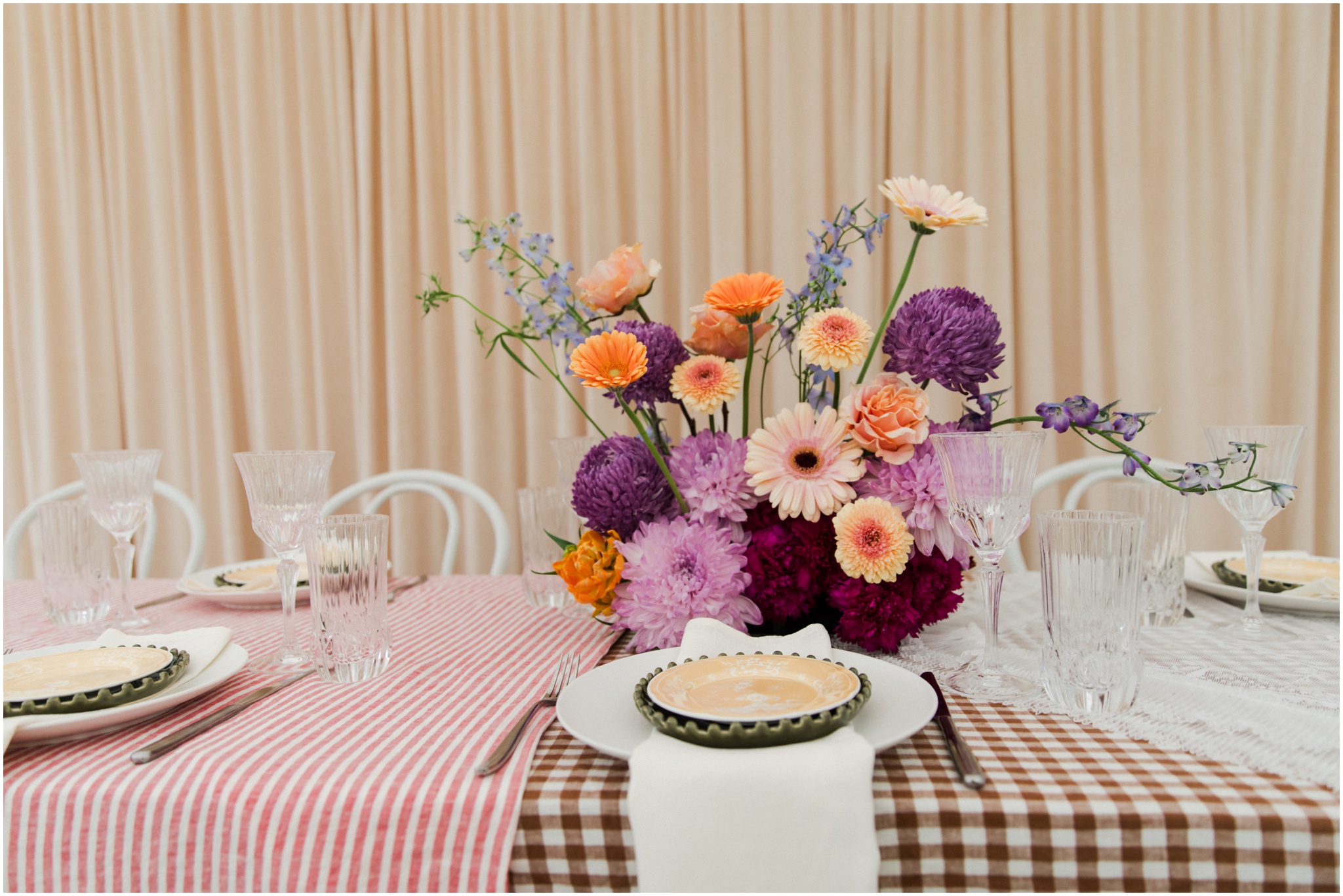 Colourful wedding tablescape with gingham linen and lace details