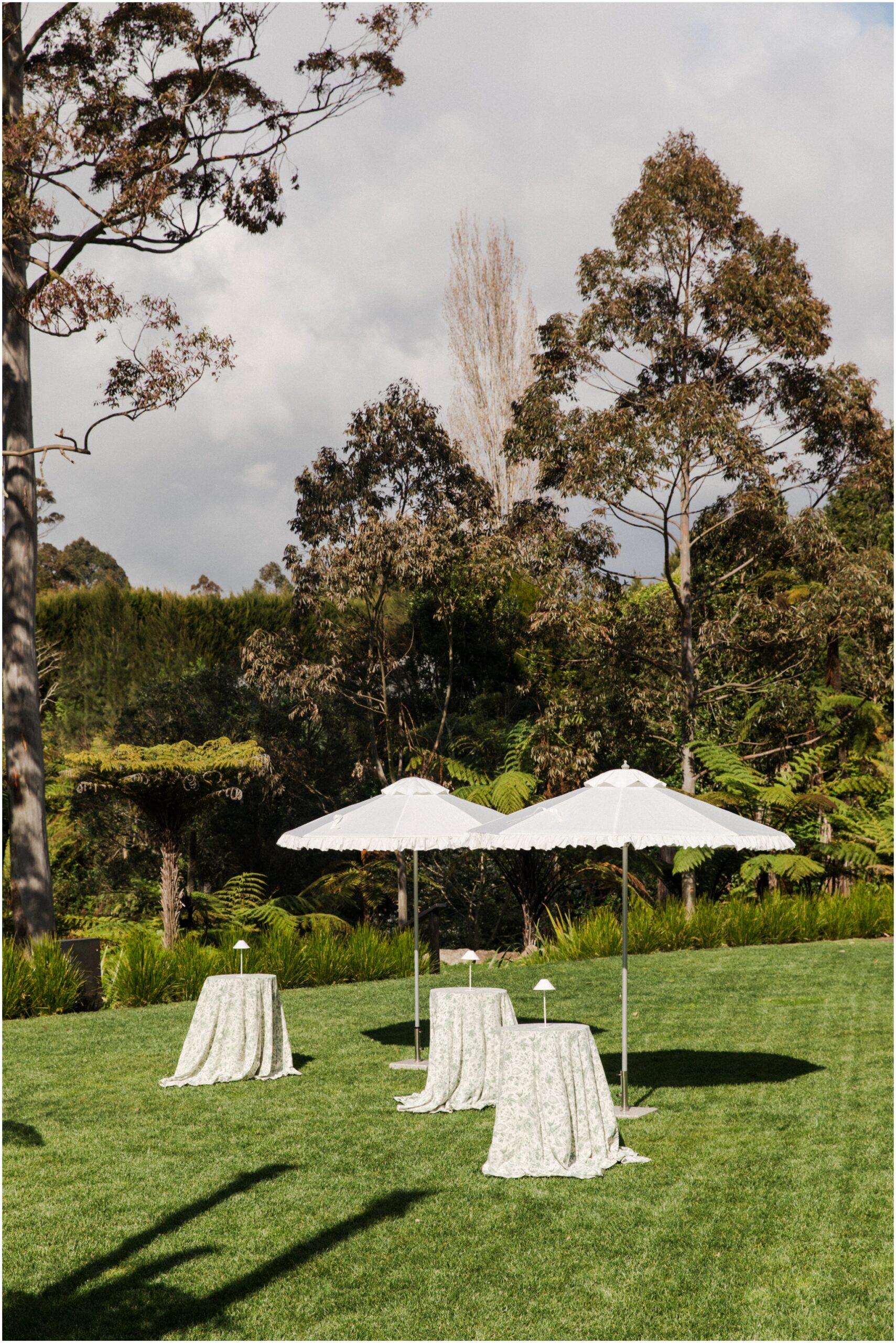 Elegant outdoor wedding styling with flowers, white linen and garden greenery